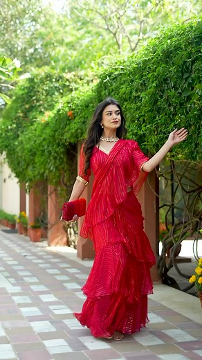 16K views · 150 reactions | Ruffles and romance, a match made in heaven! Flaunt your fierce and fabulous side in this sassy Red Ruffle Draped Saree. Shop now and turn up the heat!...#summersoiree #bunaai #womenofbunaai #rufflesaree #weddingwear | Bunaai | Facebook