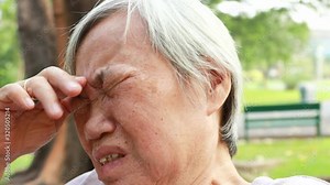 Sad asian senior woman crying and sitting alone,suffer depression problem,anxiety,feel hopeless,disappointed, elderly are crying stressed from debilitating disease, chronic illness,life,family problem