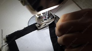 Close-up video, the process of sewing or combining clothing components that have been cut into clothes in a clothing factory.