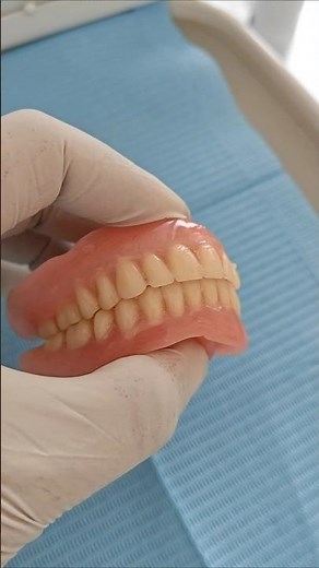 complete upper and lower dentures, often made from high-quality acrylic resin.