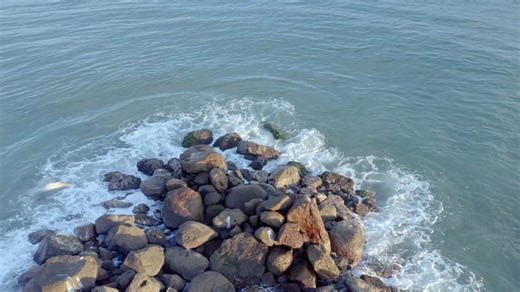 Sea waves breaking the rocks on the shore - Free Stock Video