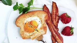Air Fryer Egg in Hole is an easy breakfast everyone enjoys! Fill up with toasty bread with an over easy right in the center. Recipe: https://forktospoon.com/air-fryer-egg-in-hole/ | Fork To Spoon