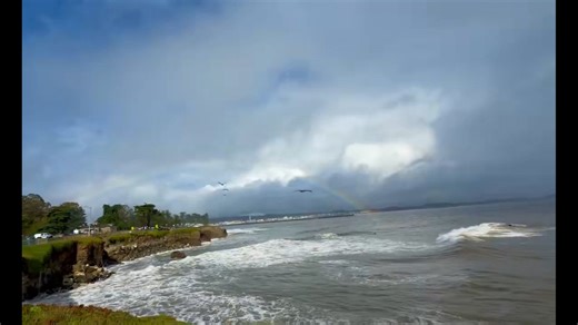 Double rainbow forms over coastal cliffs in Santa Cruz, California, USA