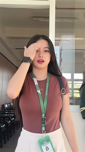 Young Woman Captivates with Charming Cafeteria Moments