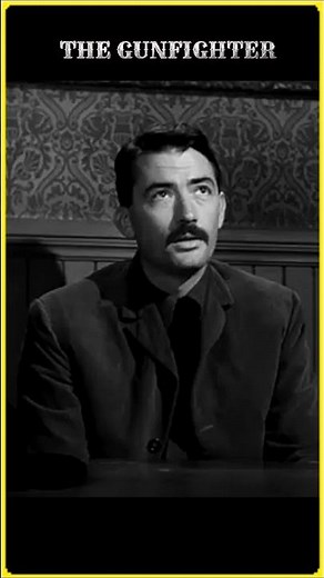 GREGORY PECK'S Got A Gun Aimed Under The Table!