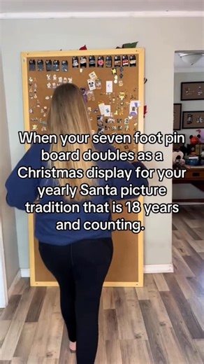 Disney Pintopia on Instagram: "🎄✨ I’m always so excited to turn our seven-foot pinboard that doubles as a Christmas display for our yearly Santa photo AND today is the day! Every year, our family gathers for this special tradition, and every year when the kids ask me what I want for Christmas I always say a Santa photo.💚❤️ Now that they’re grown, it’s even more fun to see the look on Santa’s face when a bunch of adults rolls up for a picture! One year, we even had to wear masks because of COVI