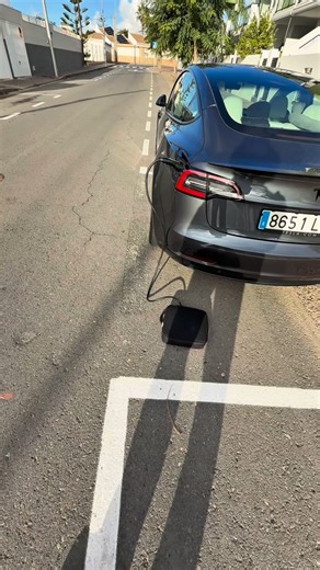 If the loading gun is locked, hold the rear door handle and it will unlock! 🔌#tesla #viralshorts #teslatrick #usa | Evgenii Kuzmenko