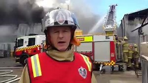 39K views · 294 reactions | More than 100 firefighters are on the scene of a factory fire on Marigold St, Revesby. Several factory units are on fire and crews are working to contain the fire and prevent it from spreading to adjoining buildings. Commissioner Mullins provides an update on the firefighting operation. | Fire and Rescue NSW | Facebook