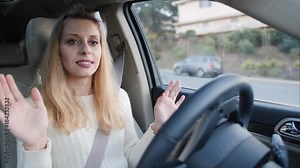Woman in autonomous car driving and parking
