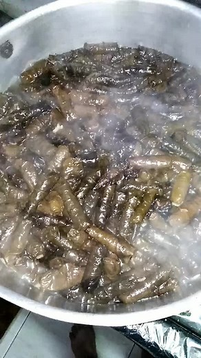 Cooking Delicious Brown Sausages in Boiling Water