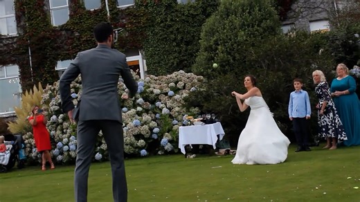 I DOH! This is the unfortunate moment a bride playing a game of rounders at her wedding smacked a ball into her new husband's groin