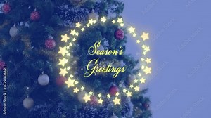 Season Greetings text animation over Christmas tree with star decorations