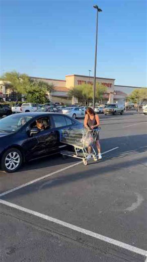 Women in parking lot argue over grocery cart hitting car