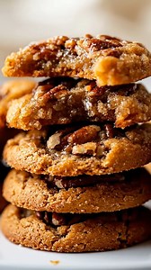Pecan Pie Cookies Ingredients: 1 cup unsalted butter, softened 1 cup brown sugar 2 cups all-purpose flour 1 cup pecans, chopped 1 teaspoon vanilla extract 1/2 teaspoon salt 1/2 teaspoon baking powder 1 egg Directions: 1. Preheat your oven to 350°F (175°C). 2. In a large bowl, cream together the softened butter and brown sugar until smooth. 3. Beat in the egg and vanilla extract until well combined. 4. In a separate bowl, mix together the flour, salt, and baking powder. 5. Gradually add the dry i
