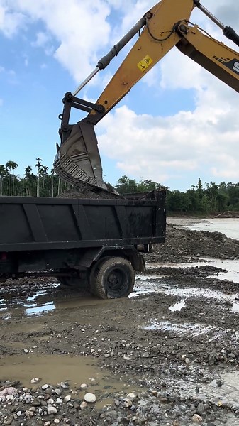Massive Excavator Working on Rocky Ground