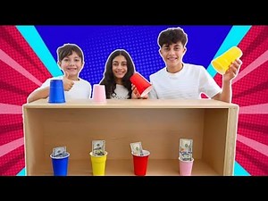 Heidi y Zidane! ¡El reto del cubo de agua y el juego de las tazas de colores!