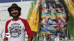 Street artist paints huge graffiti in Rio