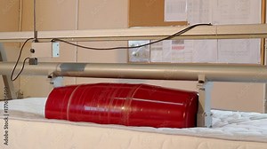 Stress test of the mattress, strength test of the mattress in the laboratory, strength, modern factory, indoors