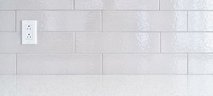 How to Add a Glass Tile Backsplash Around Outlets  | DoItYourself.com