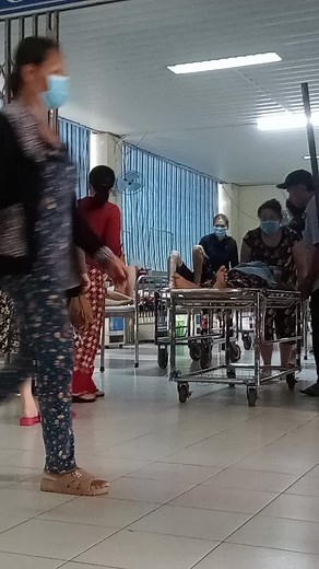 Hospital Bed Transport in a Busy Medical Corridor
