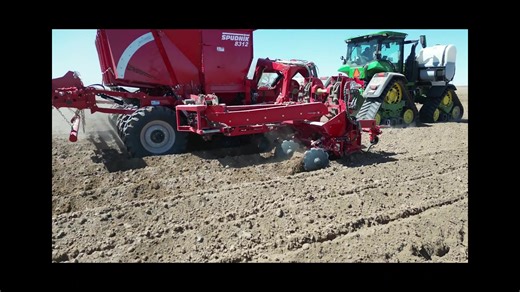 The 12 Row Folding Planter offers the efficiency of a larger planter while maintaining the compact transport size of a 6-row planter. Its advanced depth sensors ensure precise and consistent planting depth for optimal crop growth. https://na2.hubs.ly/H02JQN20 | Spudnik Equipment Company, LLC