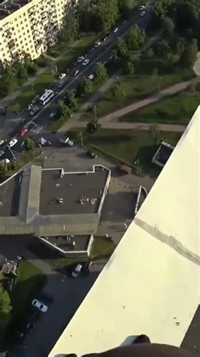 Parkour Runner Misses Jump And Falls Off High Rise Roof! #shorts