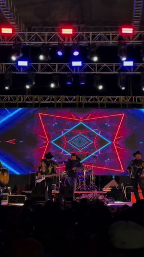 Dynamic Live Band Performance with Colorful Graphics