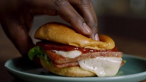 Kick ordinary burgers in the buns. Visit SPAM.com/sizzle to seize the sizzle. | SPAM