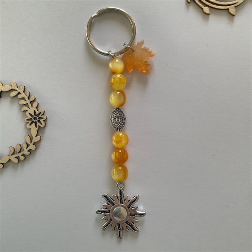 Yellow keychain made of glass beads and resin leaf, lucky charm, bag charm