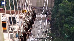 Rescue teams at wreckage of bridge collapse in Colombia