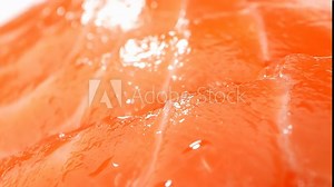 Exquisite sashimi-grade salmon, radiant in its vibrant orange hue, embodies unparalleled freshness. Each delicate slice, meticulously cut, unveils the epitome of culinary perfection.
