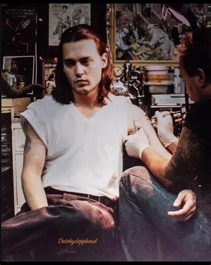 Johnny Depp got his inverted triangle tattoo in November 1999 by Jonathan Shaw. An upside-down triangle has varied meanings, symbolizing feminine energy, water, or descent in spirituality; the