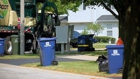 Garbage truck unloading a garbage can. USA. Naperville IL 28.09