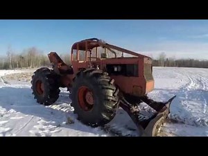 Timberjack 230 Log Skidder - Pulling Skids