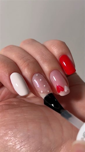 Tiffany Minifie on Instagram: "ad Valentine’s nail art hacks using gel by @essie (No UV needed) Two dots + a steady hand = the easiest heart hack ever. From polka dots to bows, these are all DIY techniques you can try at home using Rock The Runway, Pre-Show Jitters and Blushed Metal #essie #gelbyessie #valentinesnailart #valentinesnails"