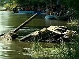 Incredible moment tank is resurrected from watery grave