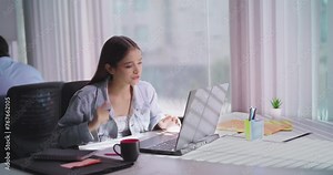 Indian Hindu gen z young adult woman lady sitting desk chair use laptop look screen do work task check online email office India teen age female girl read good day news feel great get new job deal