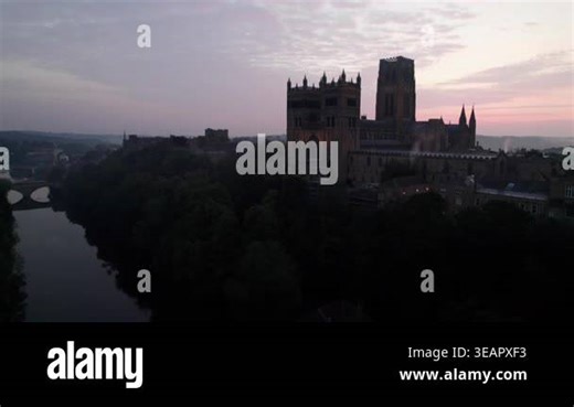 Drone rises above Durham Cathedral and the River Wear in England during a misty dawn twilight in summer Stock Video Footage - Alamy