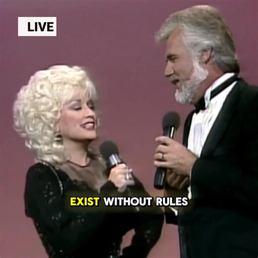 "“LOVE IS STRANGE”: WHEN KENNY ROGERS & DOLLY PARTON SANG ABOUT LOVE WITHOUT EXPLANATIONS Have you ever wondered why “Love Is Strange” feels so effortlessly human? When Kenny Rogers and Dolly Parton came together for this duet, they didn’t try to define love or control it. They simply accepted its unpredictability the joy, the confusion, the moments that make no sense at all. There’s playfulness in the exchange, but also understanding. Two voices, equal and relaxed, acknowledging that love doesn