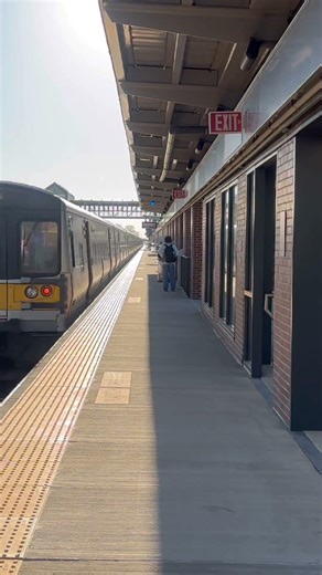 Penn Station bound LIRR M7 train passing through Westbury