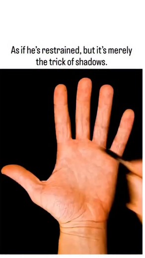 factogi on Instagram: "The post showcases a 30-second optical illusion video where marker lines and shadows on a hand mimic white restraints binding the fingers, revealed as a drawing when "cut" away, achieving 1.3 million views and 2,700 likes within hours. This trompe l'oeil effect exploits the brain's Gestalt principles, assuming continuity and depth from contrasting light and dark, similar to studies showing 70% of viewers initially perceive impossible objects as real (Gregory, 1970). Indone