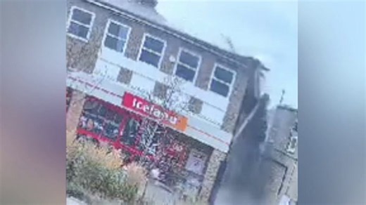 Masonry rains down on busy high street as roof above Iceland supermarket collapses