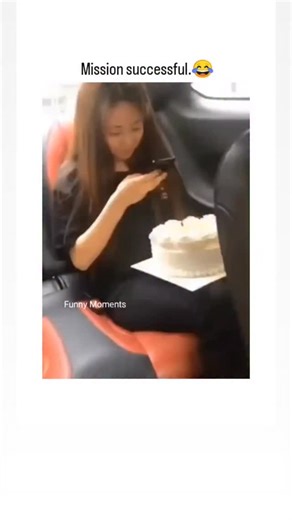 SP on Instagram: "🍰 Content Analysis: The Vehicular Vandalism Prank This short-form video documents a high-velocity, close-quarters cake smash. It opens on a young woman meticulously checking her phone, holding a pristine white frosted cake in her lap within the backseat of a car. The tension is instantaneously resolved as a male passenger, strategically positioned in the seat directly ahead, violently thrusts his seat backward, perfectly executing the surprise attack. The resulting impact cove
