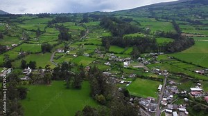 Andean farming landscape lush green fertile pastures rural homesteads AERIAL