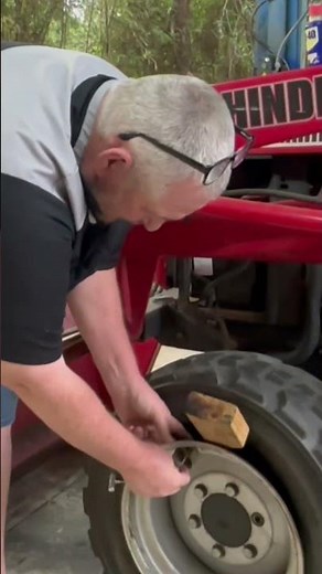 Replace a valve stem on a tractor tire!