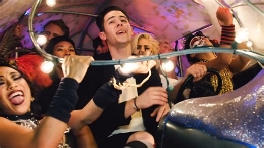 Nick Jonas Throws a Party in Colorful New “Chains” Video
