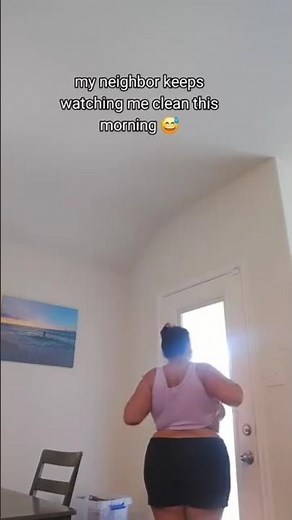 My neighbor is spying on me while I clean, and I show him my breasts.