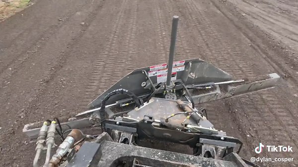 Skeer System Pro Plus in its element fine grading asphalt millings! With grading widths at 7, 9.5 and 12’ wide, it has been a game changer for tight, compact areas. #skeersystems #grading #catconstruction #skidsteersolutions