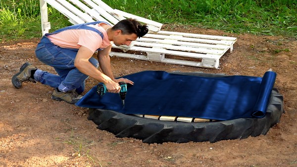 Easy Backyard Pool Made from Pallets and a Big Wheel for Ultimate Enjoyment!