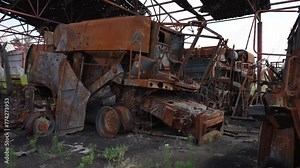Transformation of harvester into ruins due to rust. Concept of destruction, destruction.